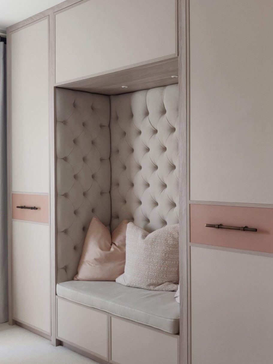 Tivoli wardrobe with reading nook A modern, stylish nook with padded walls and cushions in soft, neutral tones.