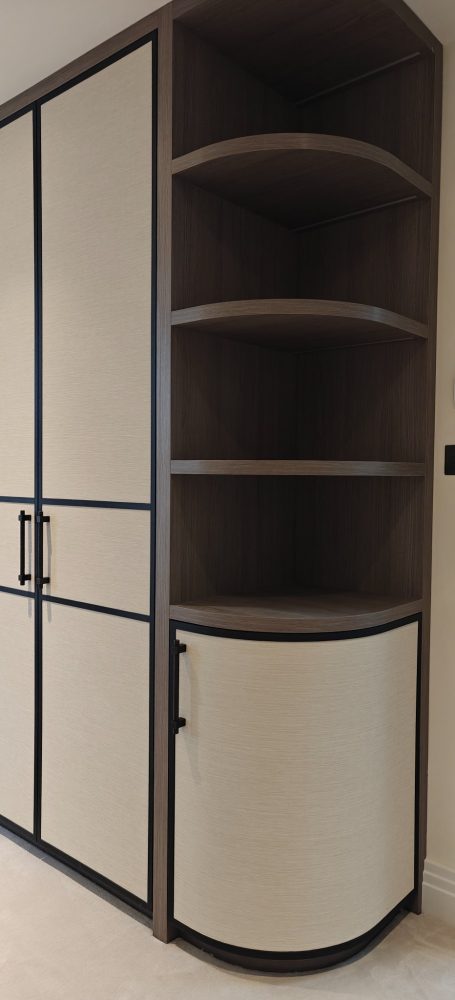 Grey Vicenza Oak dressing room curved door with wallpapered panel Modern storage unit with open shelves and a curved cabinet door.