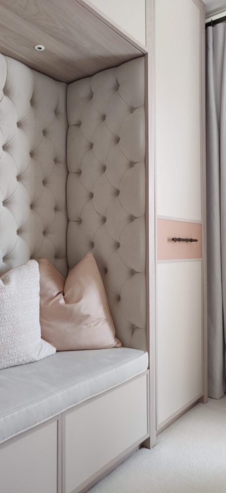 Tivoli wardrobe with reading nook Cozy corner with tufted wall, cushions, and soft lighting for relaxation.